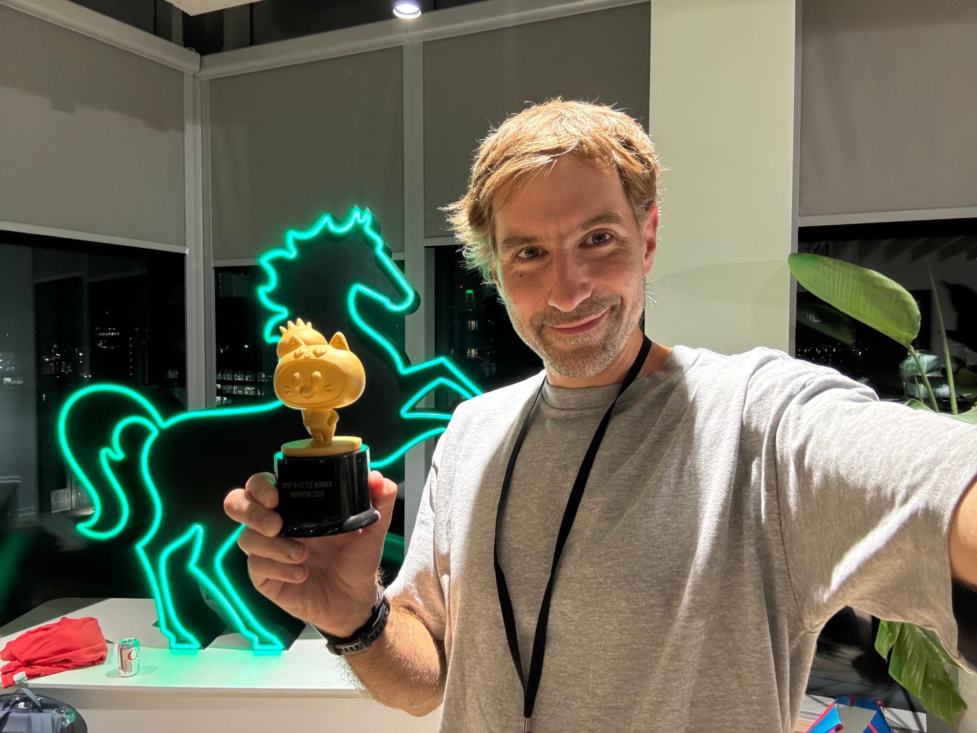 Holding the “Ship a Little Winner” trophy at the Leeds Mobile Meetup